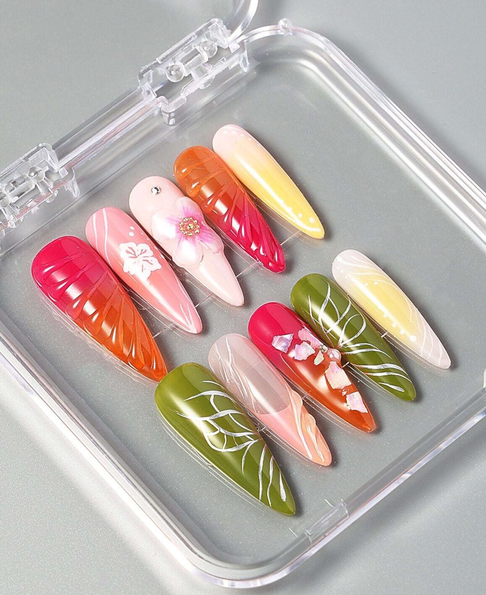 Colourful press-on nail design with raised flower decorations